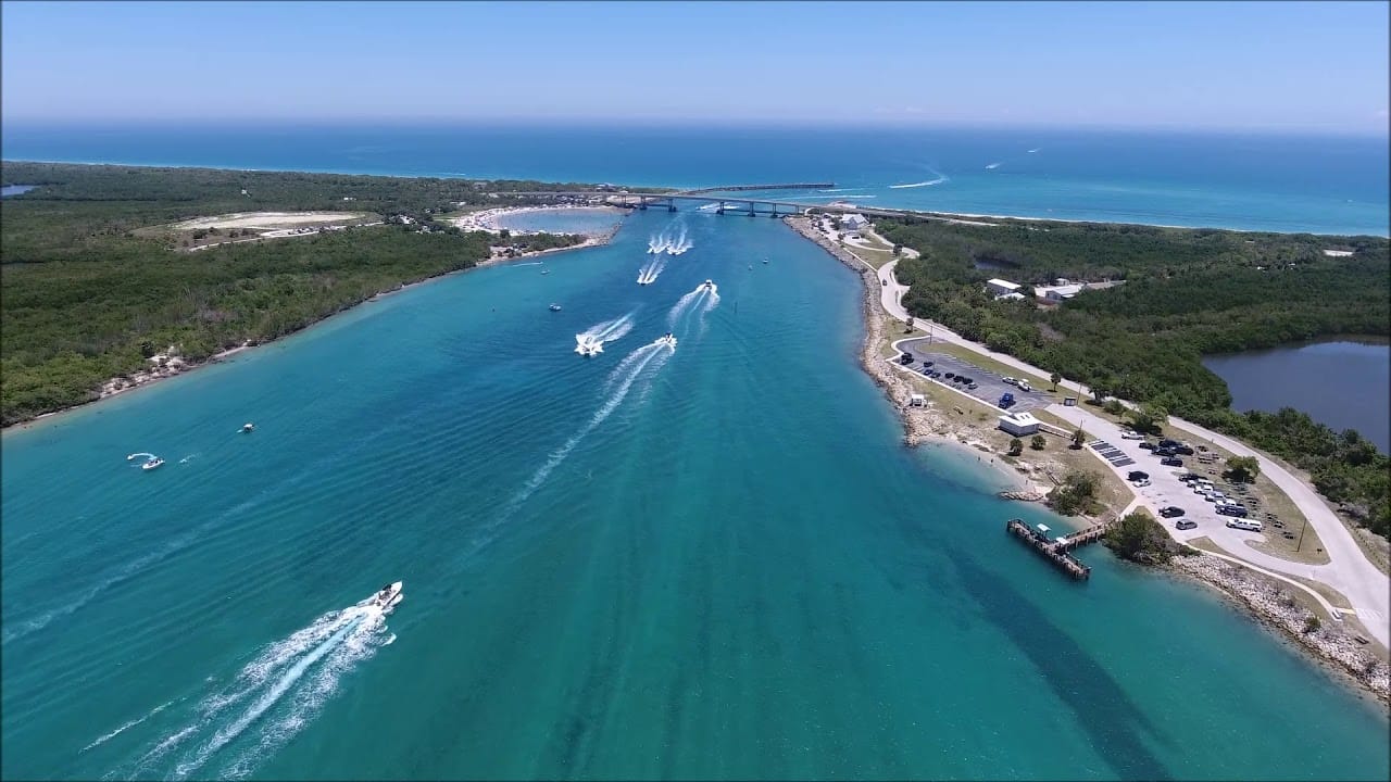 Aerial view of Sebastian Inlet, the boating cut at the north end of Orchid Island near Vero Beach, Florida, with boats running the channel